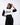 Person wearing a black and white hoodie with 'SKZ' branding on a white background