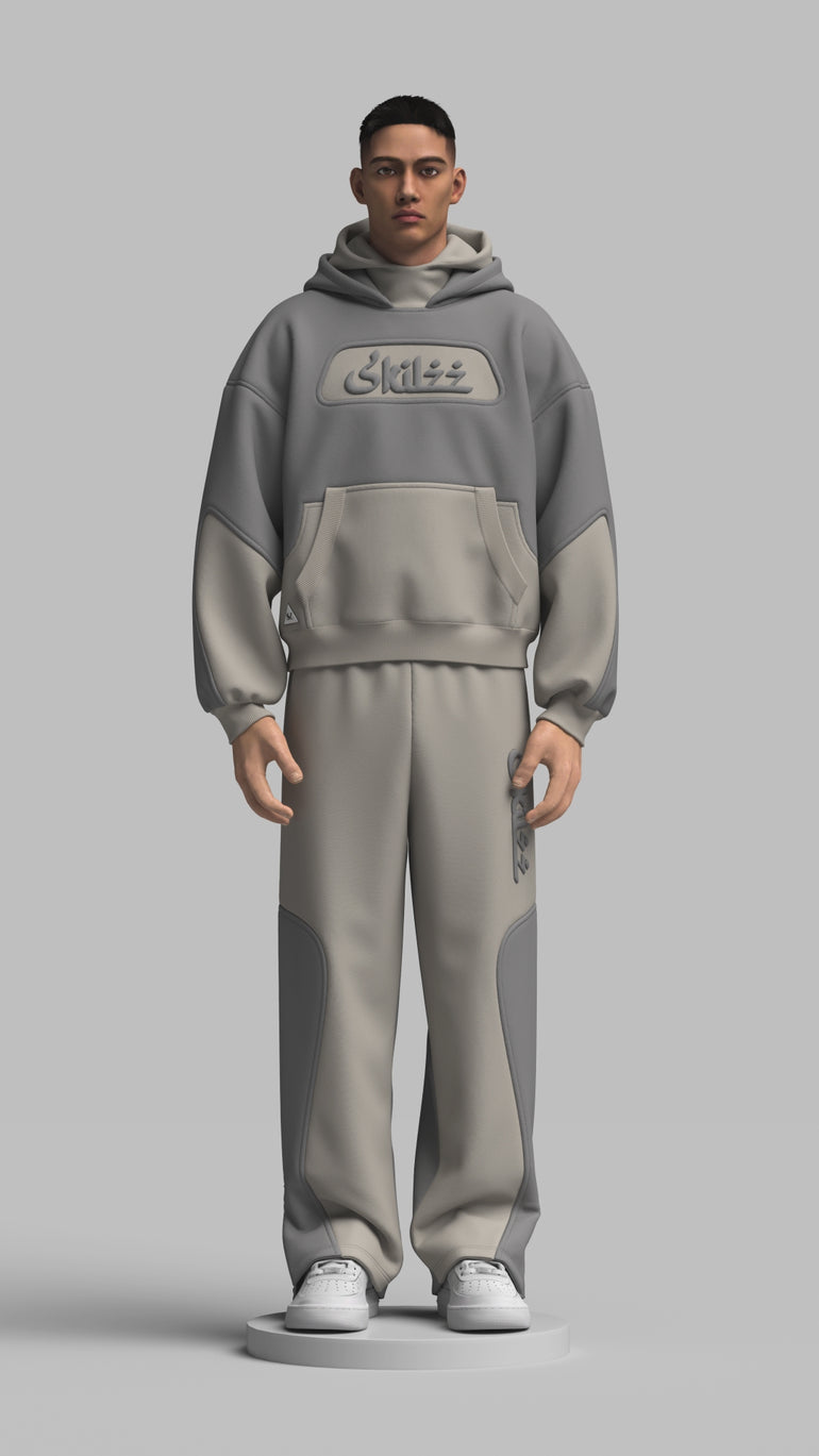 blue and grey track suit which skilzz writing in front